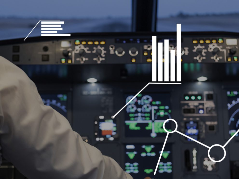 Ein Flugzeug-Cockpit, das von einem menschlichen Arm gesteuert wird.